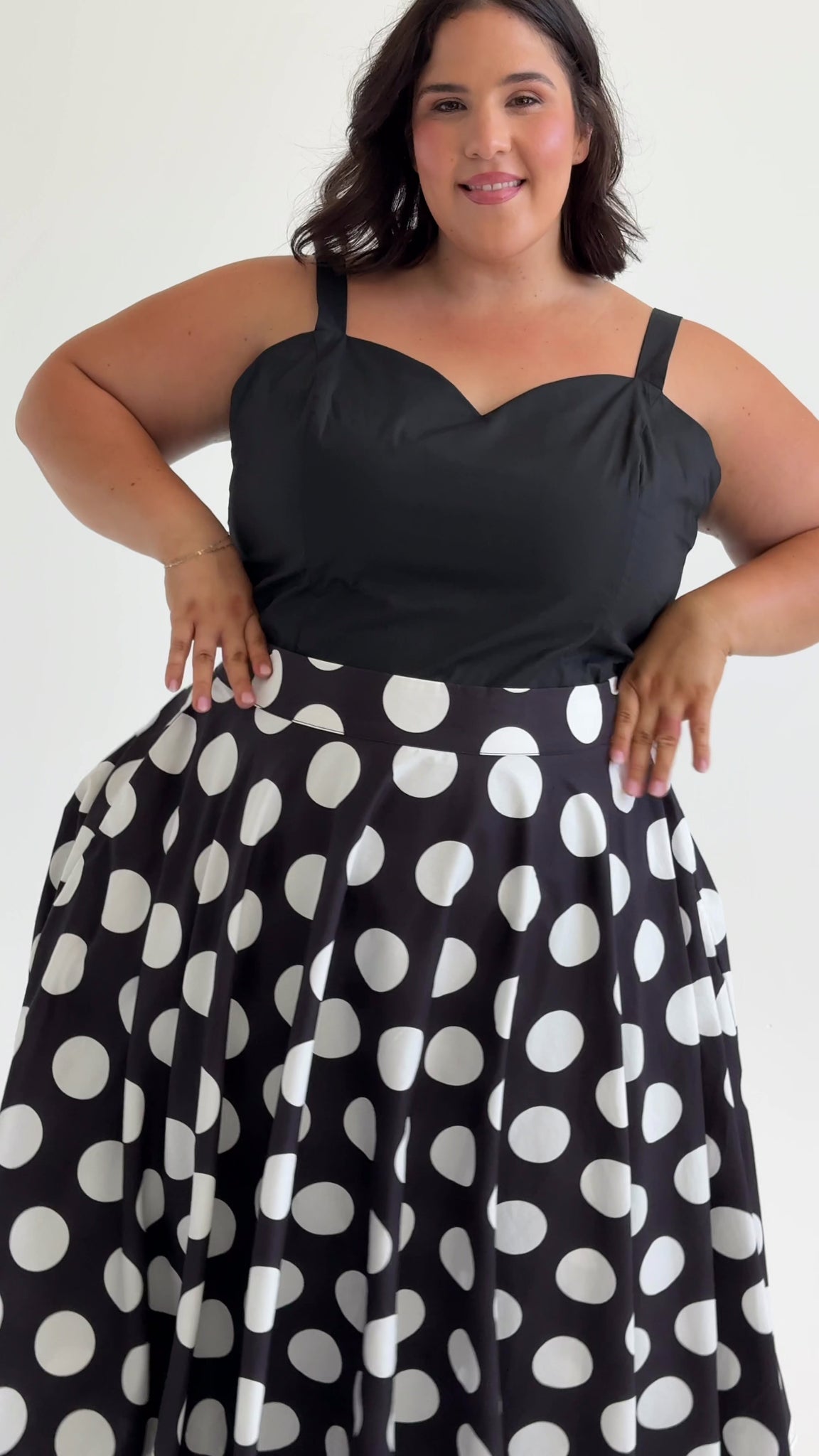 Style video of Circle Polka Dot & Stripes Midi Skirt made from sustainable cotton by Cherry Bobbins. Shown on 3 different models, sized 12, 16 & 20. This style comes with pockets.