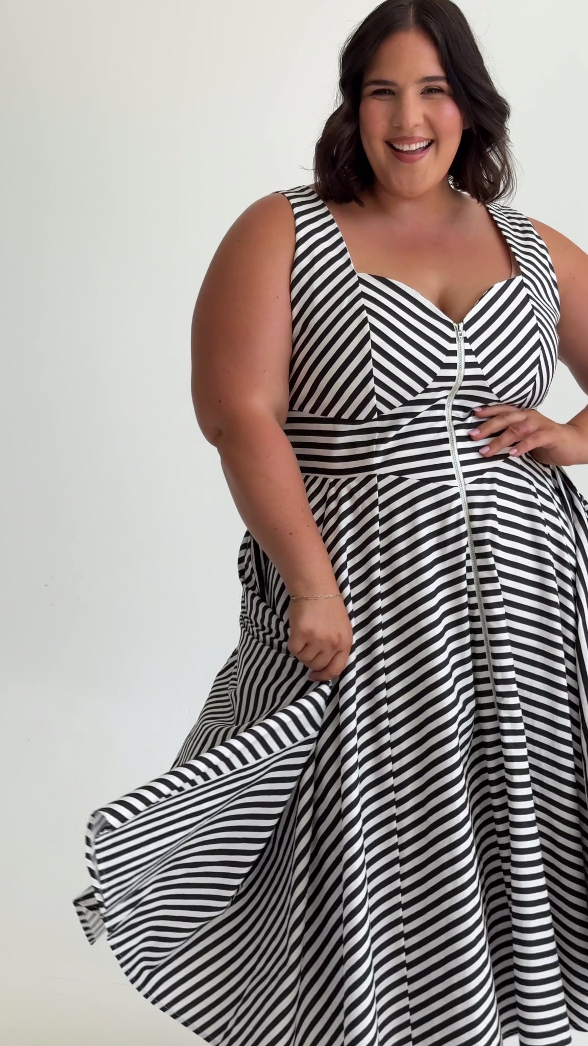 Style video of Cherry Bobbins Taylor Midi Dress. Made from sustainable cotton, shown on models in sizes 12, 16 and 20.